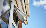 Close up of White UPVC fanlight window fully open from the Anglian window range