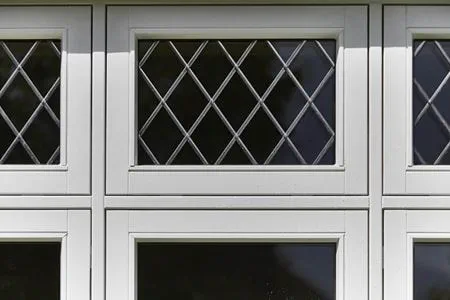 Close up of top hung casement with lead bars on a White wooden flush window from Anglian Home Improvements