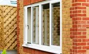 UPVC dining room double glazed window finished in White Knight from the Anglian casement window range