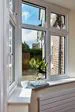 Triple glazed UPVC casement windows finished in White on porch from Anglian Home Improvements