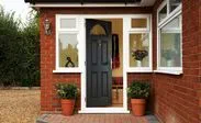 Anthracite Grey composite front door in traditional style with chrome handle and knocker from the Anglian composite doors range