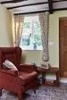 Interior view of Dual White and Sage Green UPVC double glazed casement windows with cottage bars from Anglian Home Improvements