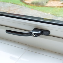 Load image into Gallery viewer, Black Flush Casement Window Locking Handle on White uPVC Window, buy now at Anglian Home Improvements
