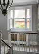 Double glazed White UPVC sash window in upstairs hallway from the Anglian sash window range