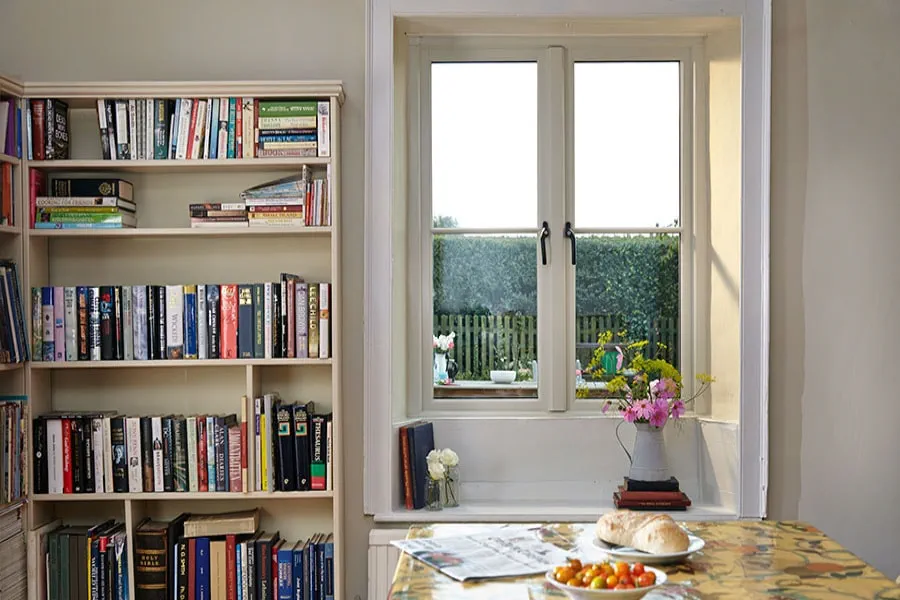 Cottage style wooden window finished in white with central mullion from Anglian Home Improvements